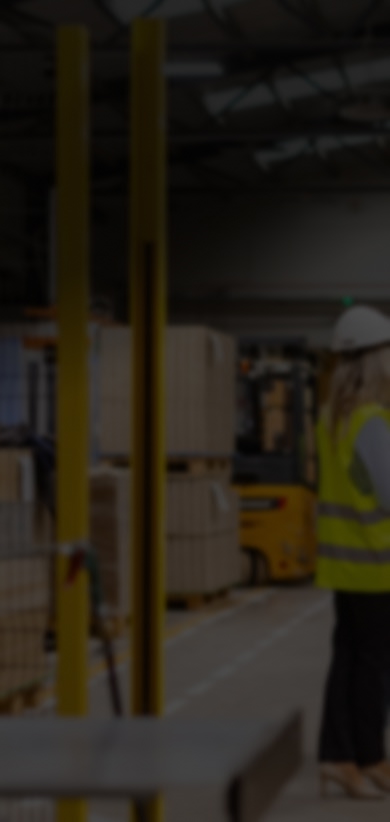 Factory workers discuss strategies for reducing plastic packaging waste.
